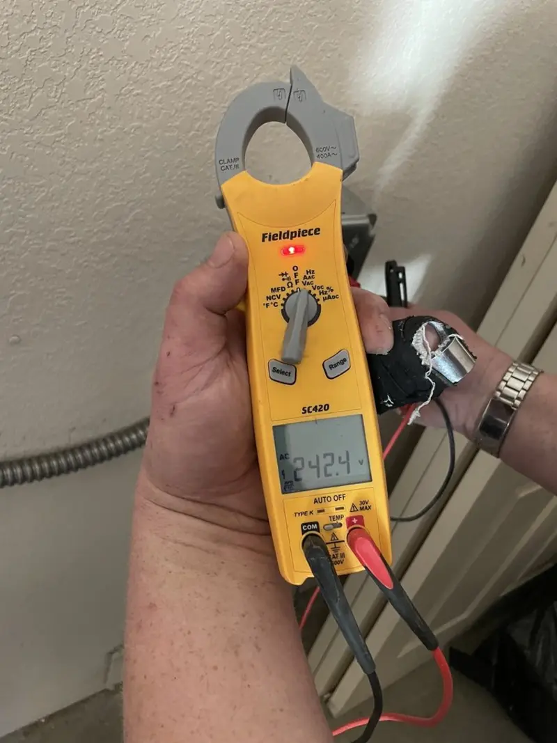 Voltage testing with clamp meter during Recessed Lighting Installation in Lower Merion